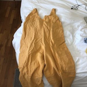 mustard color jumpsuit with pockets